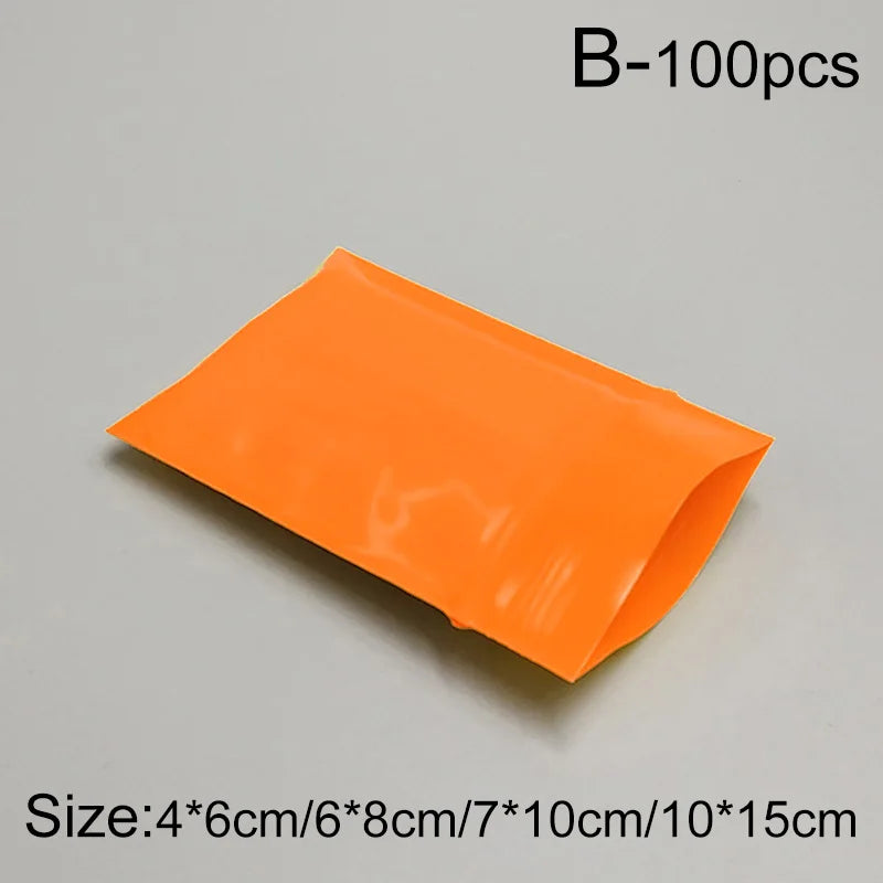 Set of 100 Bulbusbow color PE plastic zip lock bags, perfect for organizing jewelry, tea, food items, and travel essentials. Durable, eco-friendly design with secure sealing.