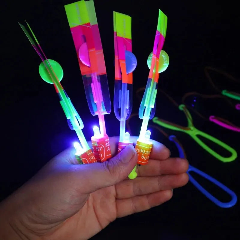 5pcs Amazing Light Toy Arrow Rocket Helicopter Flying Toy LED Light Toys Party Fun Gift Rubber Band Catapult