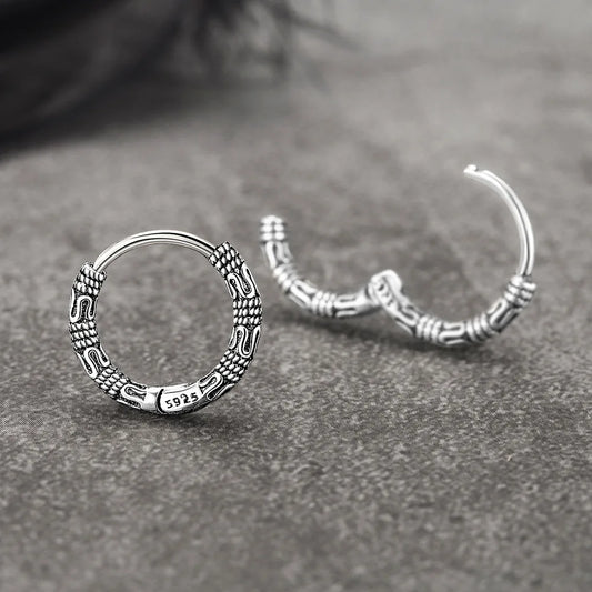 Close-up of Vintage 925 Sterling Silver Hoop Earrings with round pattern design for women.