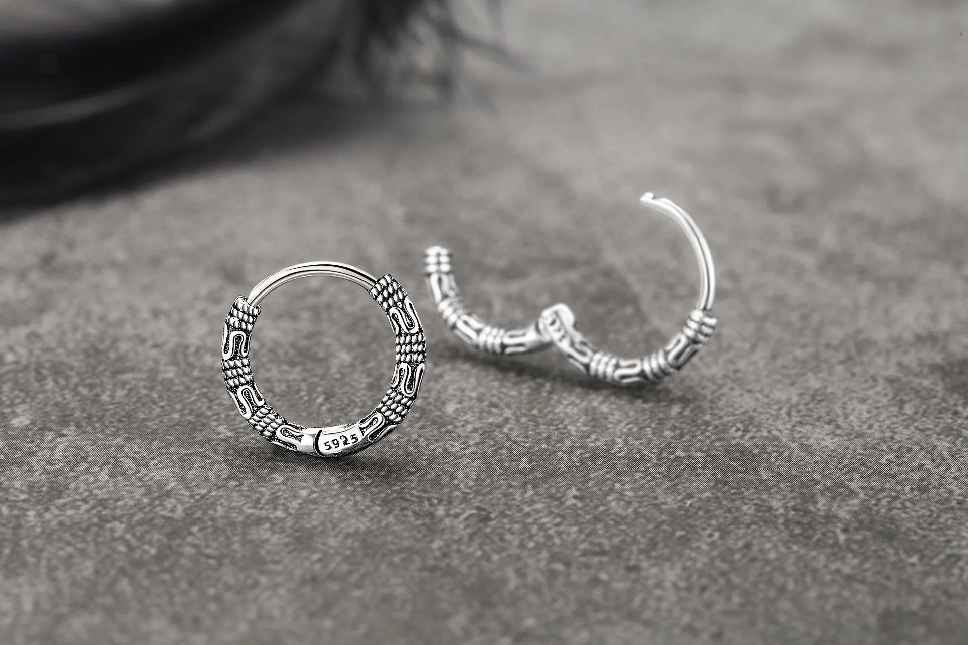 Close-up of Vintage 925 Sterling Silver Hoop Earrings with round pattern design for women.