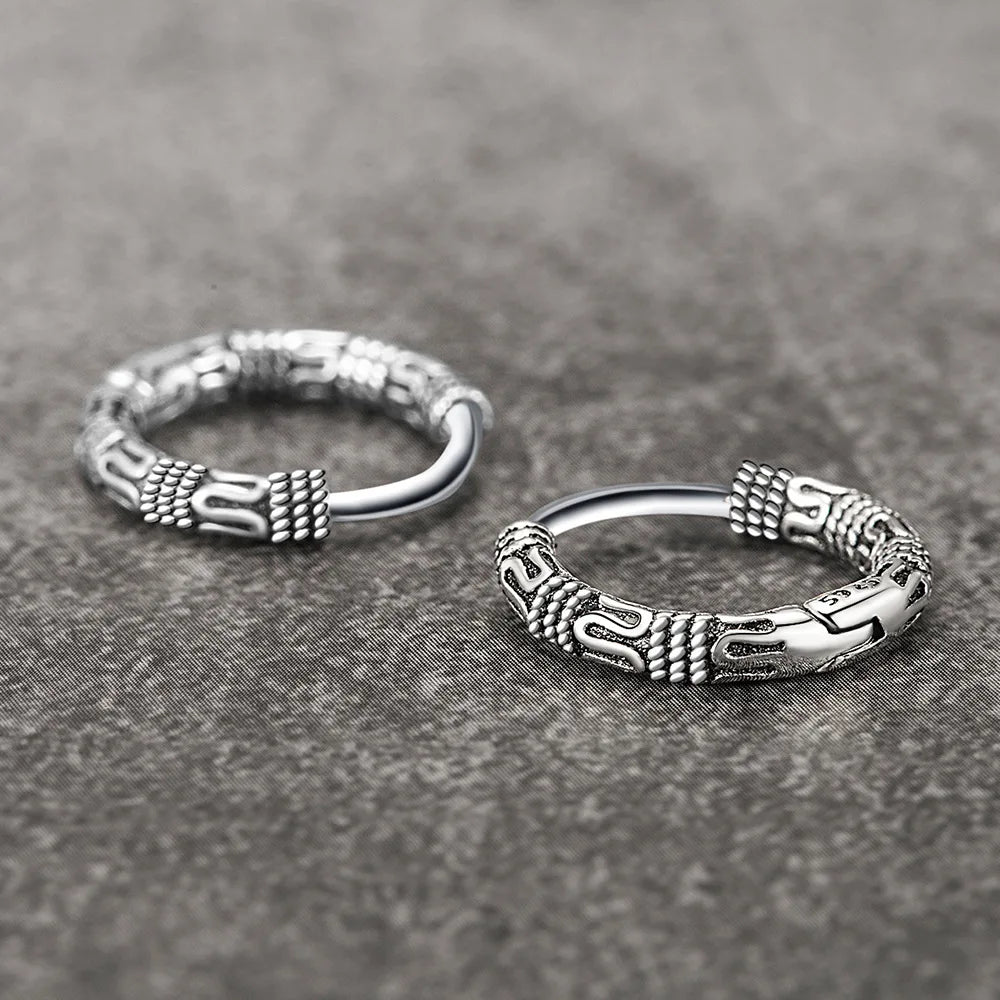 Close-up of Vintage 925 Sterling Silver Hoop Earrings with round pattern design for women.