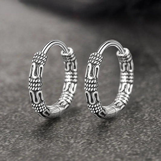 Close-up of Vintage 925 Sterling Silver Hoop Earrings with round pattern design for women.