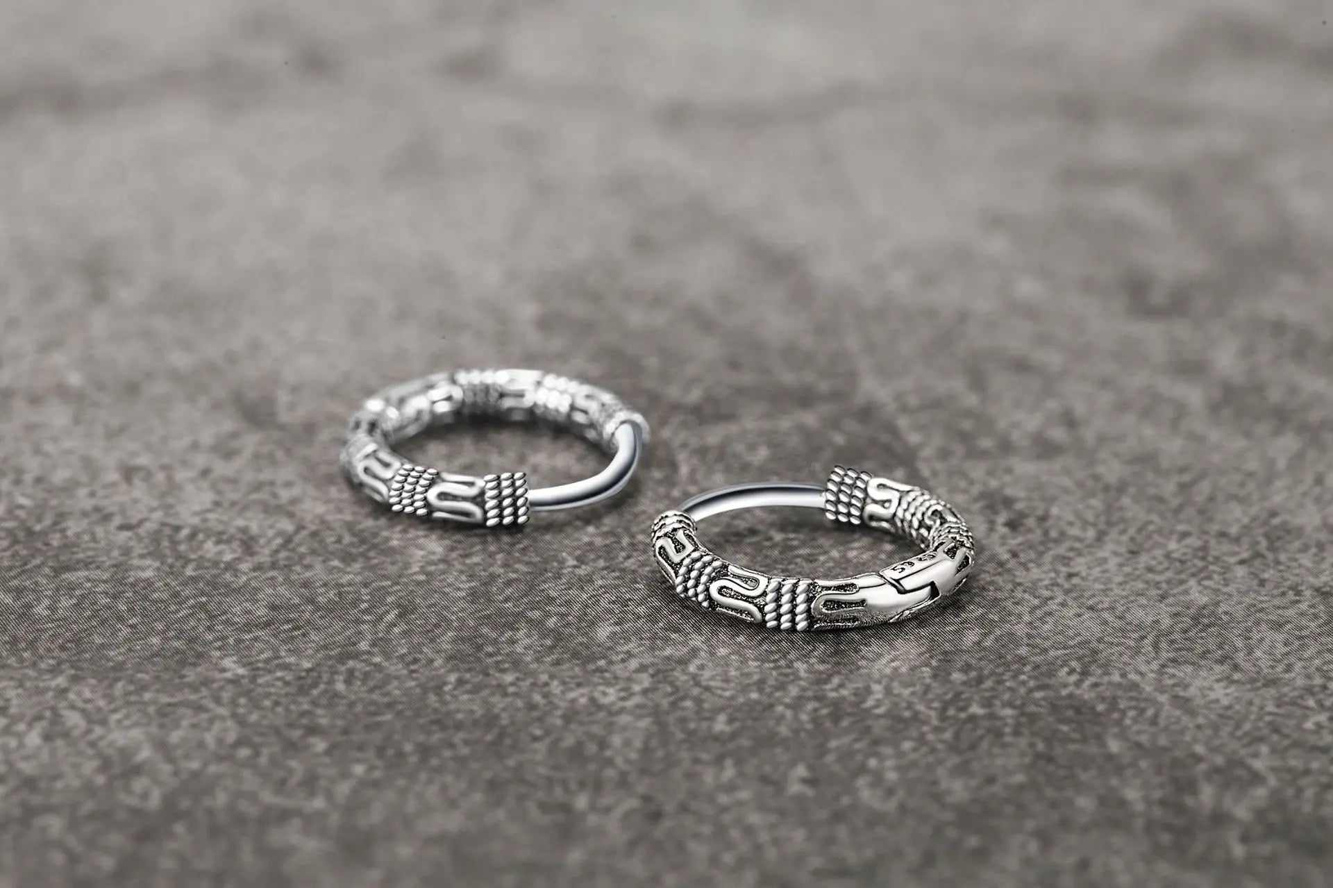 Close-up of Vintage 925 Sterling Silver Hoop Earrings with round pattern design for women.